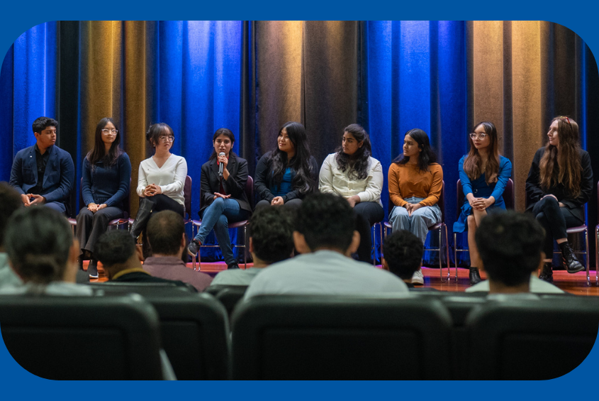 Business Honors Program Ambassadors sharing their experience at an info night in the Student Union Theater